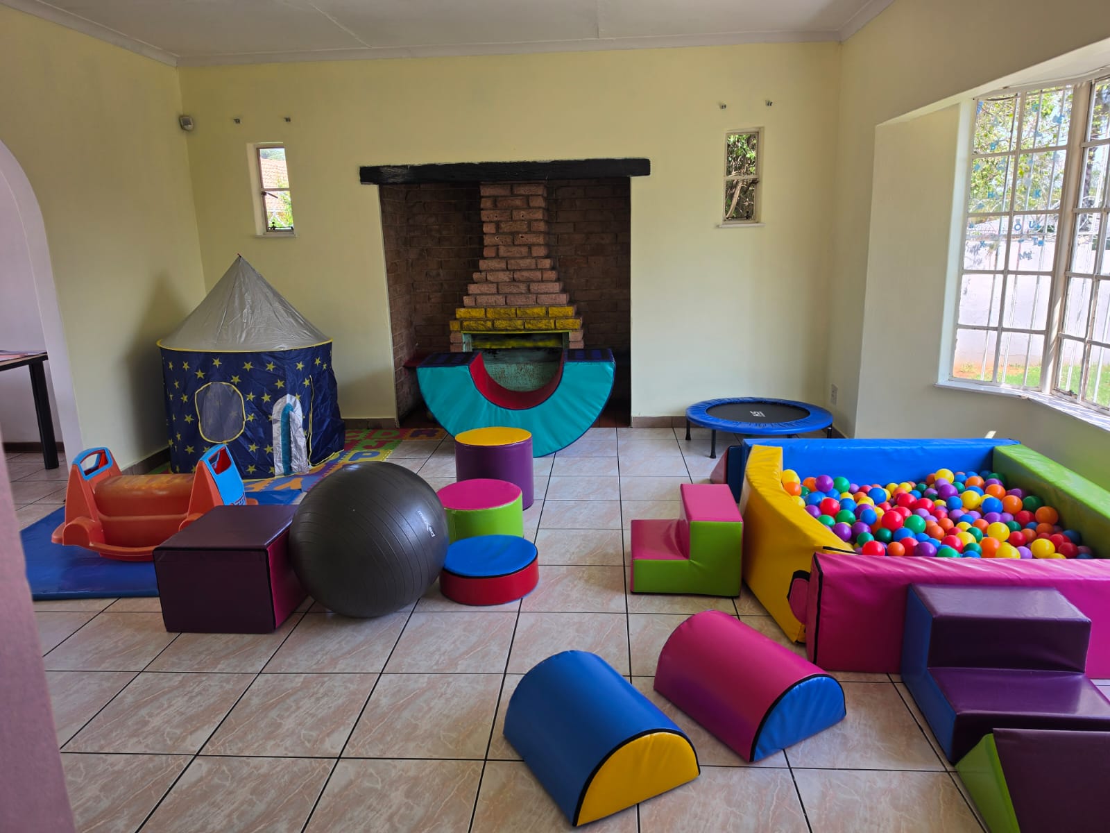 The colourful indoor play and sensory room at Golden Bridge Kids Center